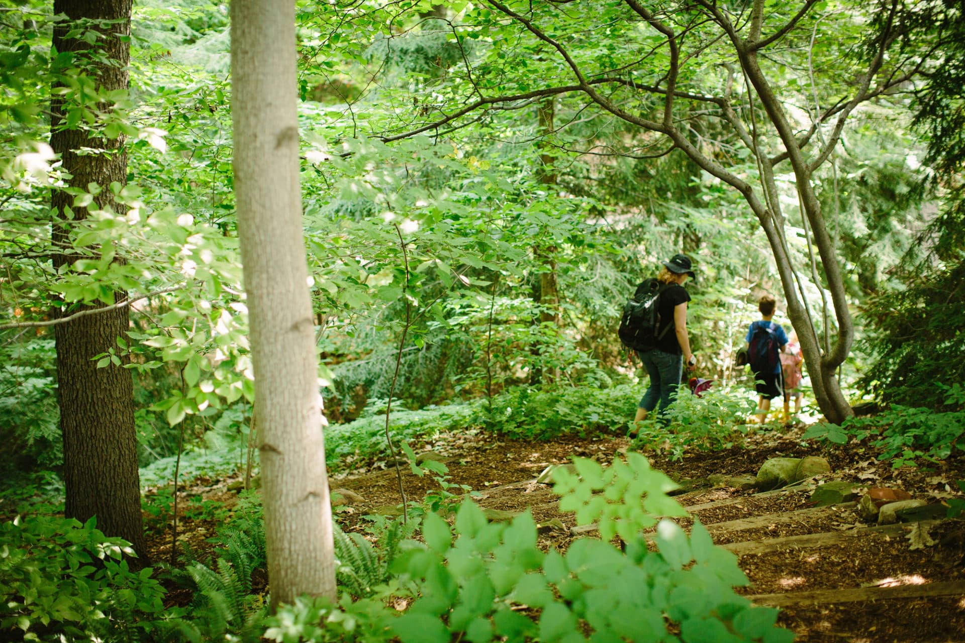 Mother and son walking on Woodland Garden Trail